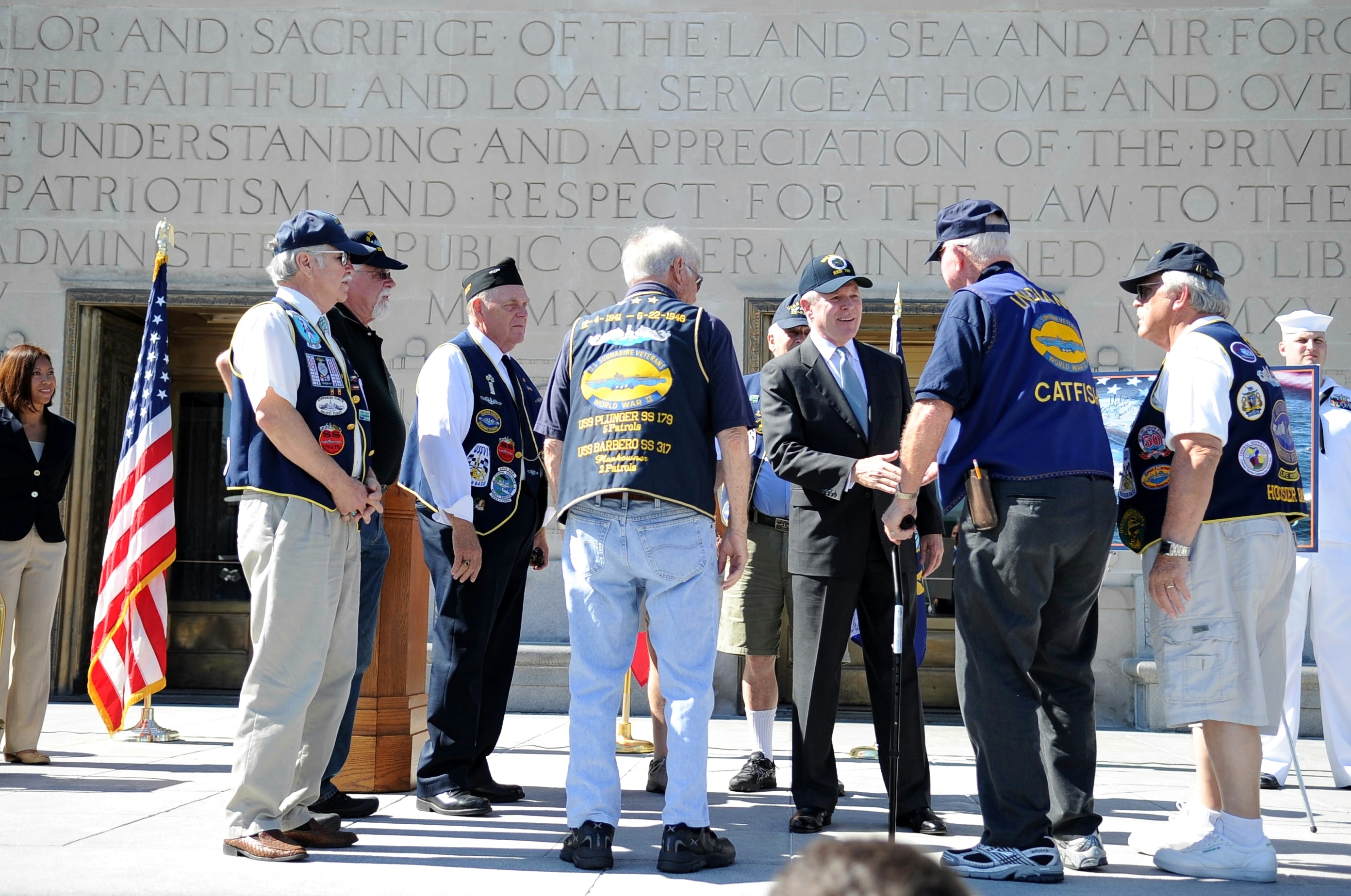 Secretary of the Navy (SECNAV) the Honorable Ray Mabus greets Navy veterans during a ceremony celebrating the naming of the Virginia-class submarine, USS Indiana (SSN 789), at the Indianapolis War Memorial.